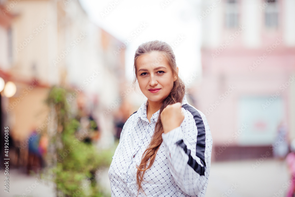 Happy young woman looking around in the city Happy young woman looking around in the city