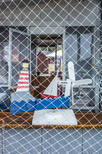 USA, Maine, Wiscasset. Local crafts, weather vane with nautical motif. photo