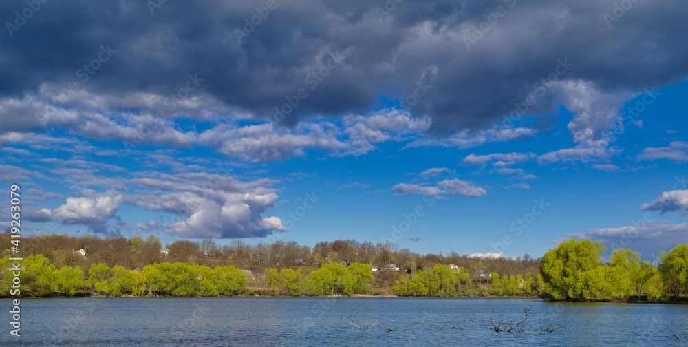 Spring rural landscape, field, landscape with clouds and sky, landscape with lake