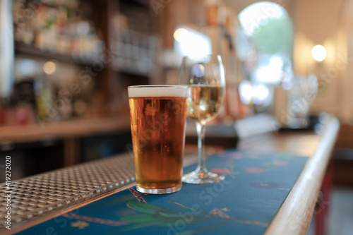 Close up beer and white wine on bar counter