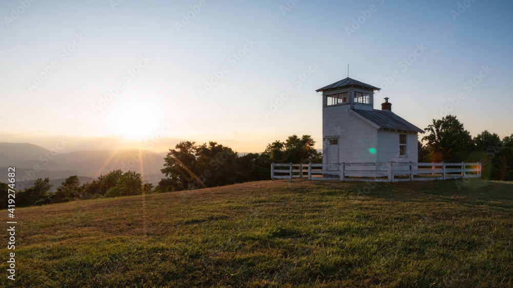 Clear skies at sunset viewed from a historic fire watchtower within the foothills of Shenandoah National Park.