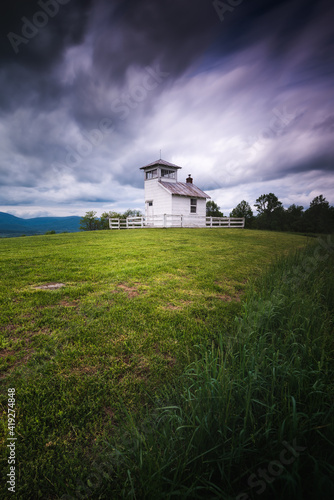An old fire watchtower atop the foothills of Shenandoah National Park on a cloudy afternoon Summer day.