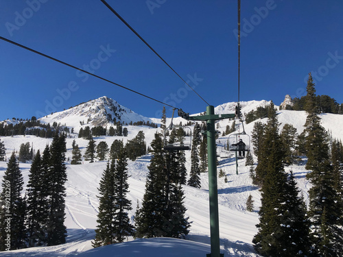 Riding a Chairlift at Mountain Ski Resort photo