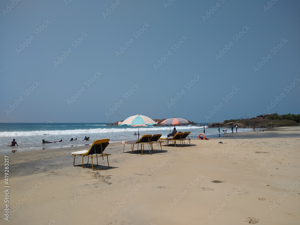 beach and umbrellas on the beach, kovalam beach, Thiruvananthapuram Kerala beach and umbrellas on the beach, kovalam beach, Thiruvananthapuram Kerala