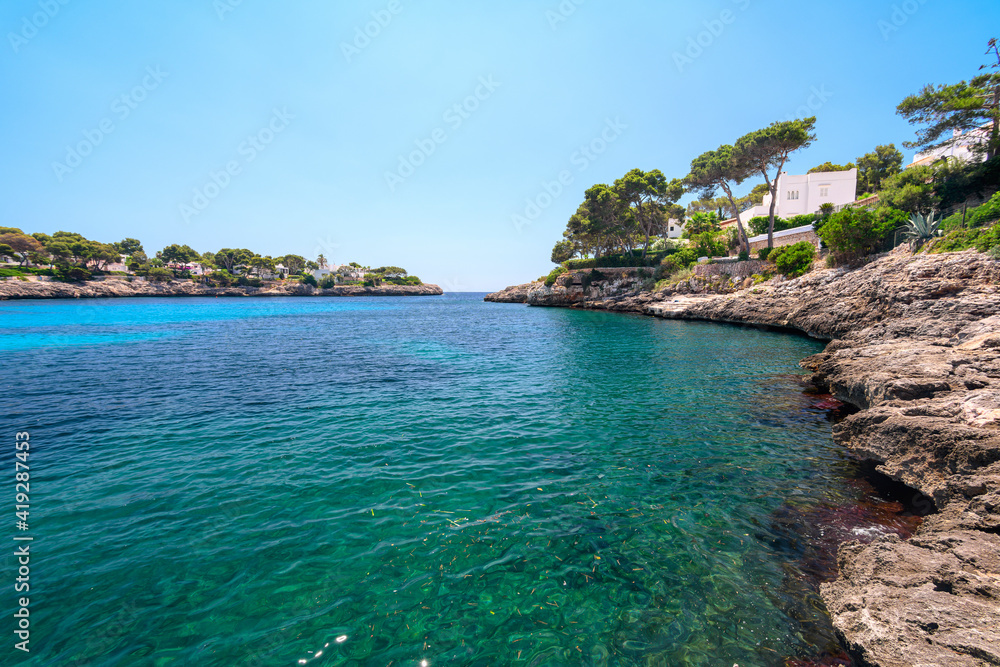Cala d'Or lagoon on Mediterranean Mallorca island in Spain on a sunny day
