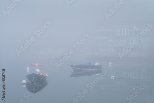 USA, Massachusetts, Cape Ann, Gloucester. Annisquam Harbor, boats in fog photo