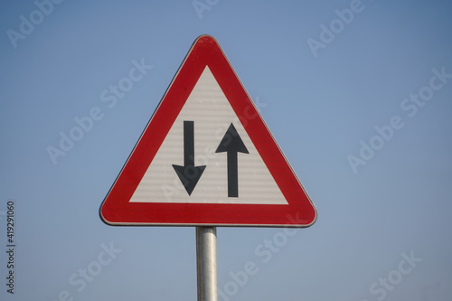 Traffic in both directions. Road sign.