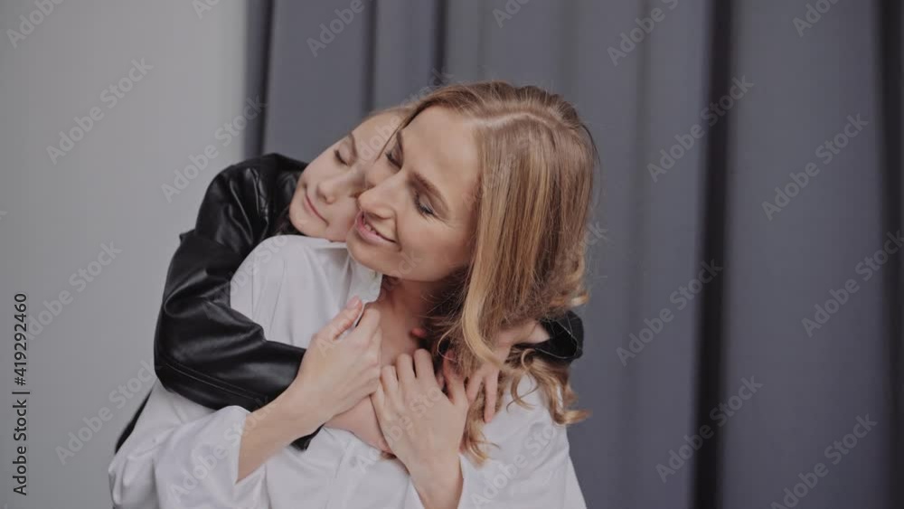 Mother and Daughter embracing. Hugs and kisses. Lovely parenthood Mother and Daughter embracing. Hugs and kisses. Lovely parenthood