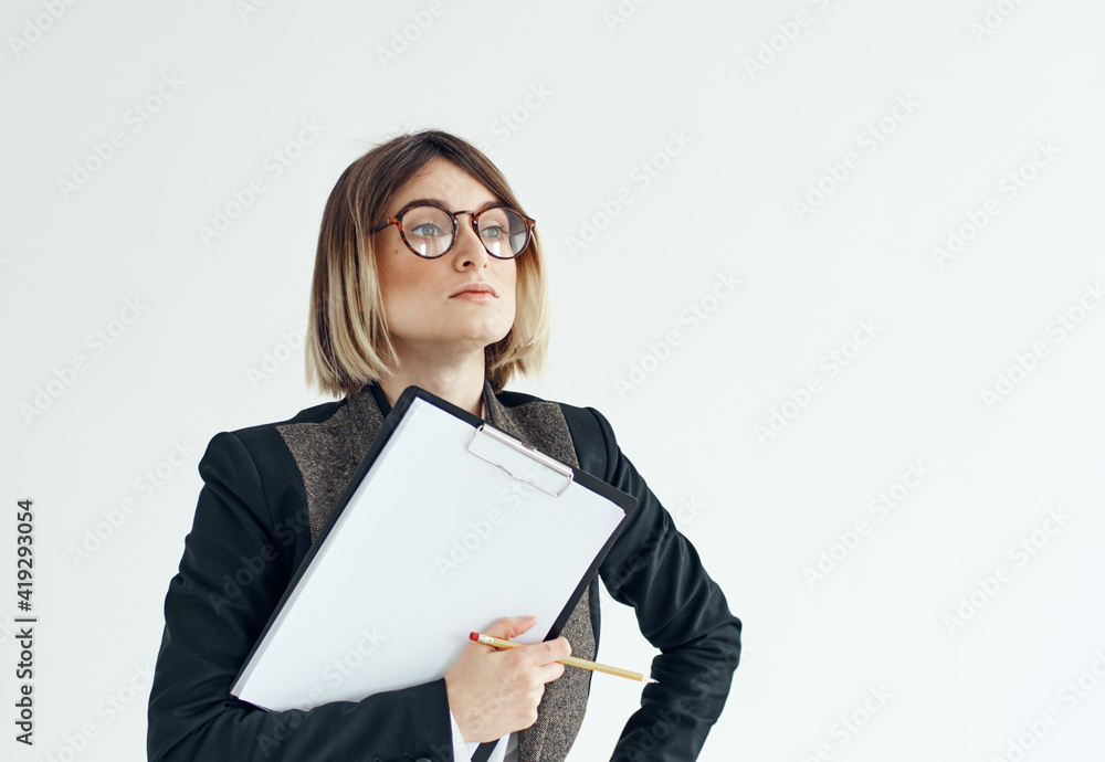 Woman download with documents in hands on a light background Woman download with documents in hands on a light background