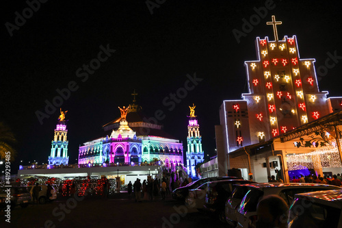 Edappally st George church Christian catholic lit up Christmas lights LED decoration Xmas celebration Kerala India. religion Jesus Christ visit pilgrim center Easter  photo