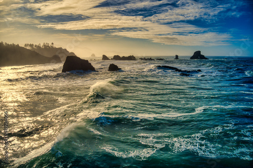 Waves crashing at sunrise