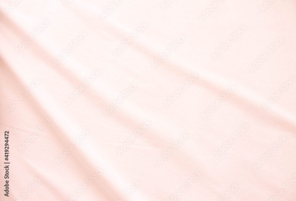 Fototapeta premium Fabric texture with light waves. A sheet of delicate color.