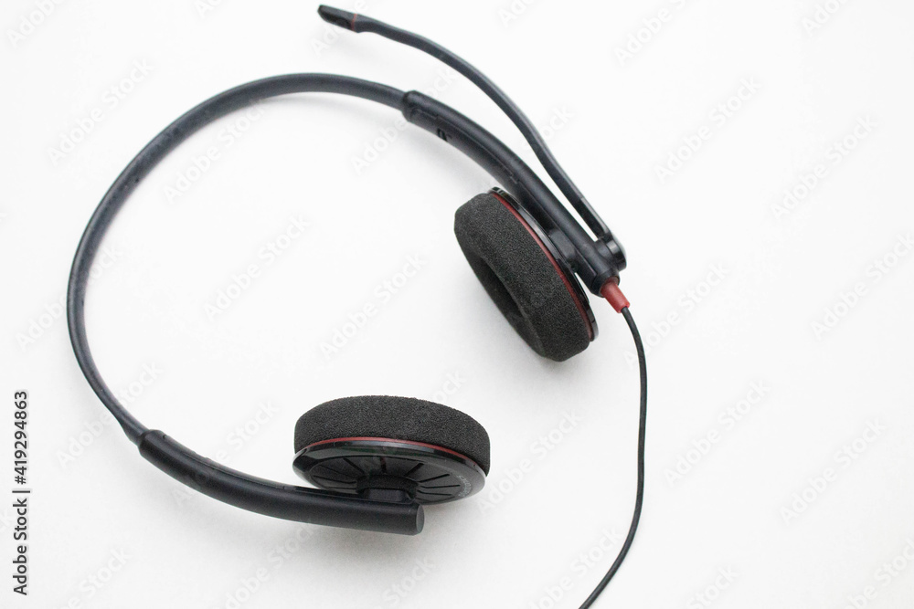 Headphones with microphone on a white background. Headphones with microphone on a white background.