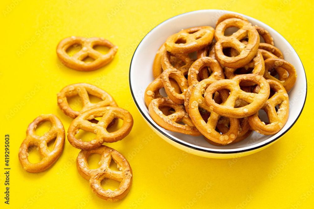 Pretzel in a plate on an isolated background. Pretzel texture. Pretzel in a plate on an isolated background. Pretzel texture.