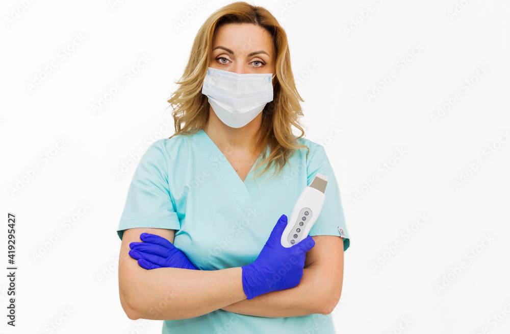 Close-up of a beautician in blue suit holding an ultrasound apparatus. isolated on white background. Close-up of a beautician in blue suit holding an ultrasound apparatus. isolated on white background.