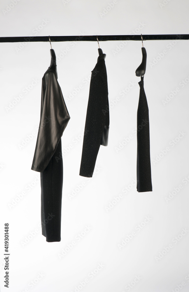 Elegant and trendy women's clothes hanging Elegant and trendy women's clothes hanging