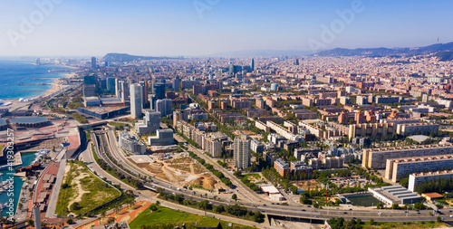 Panoramic aerial view of modern area of Diagonal Mar i el Front Maritim del Poblenou in coastal zone of Barcelona, Spain