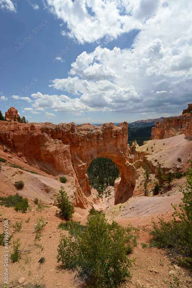 Scenic view of an arch and the red sandstone hoodoo rock formations at Bryce Canyon National Park