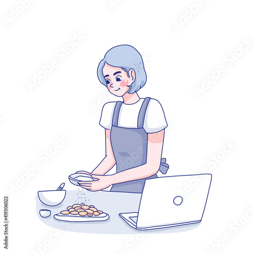 Girl is cooking from online courses.