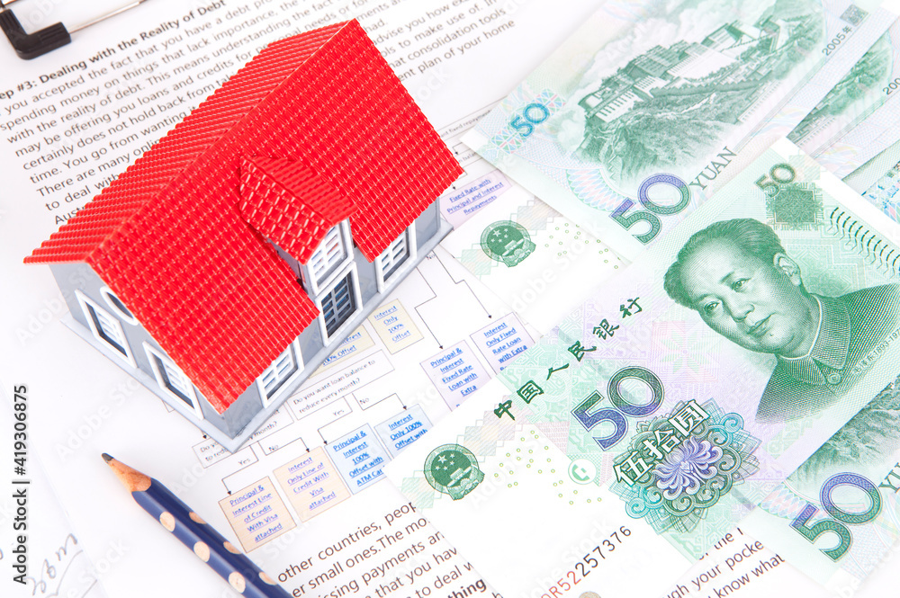 RMB notes and house model Stock Photo | Adobe Stock