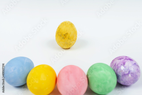 Easter egg decorated with glitter. Easter eggs on a white background