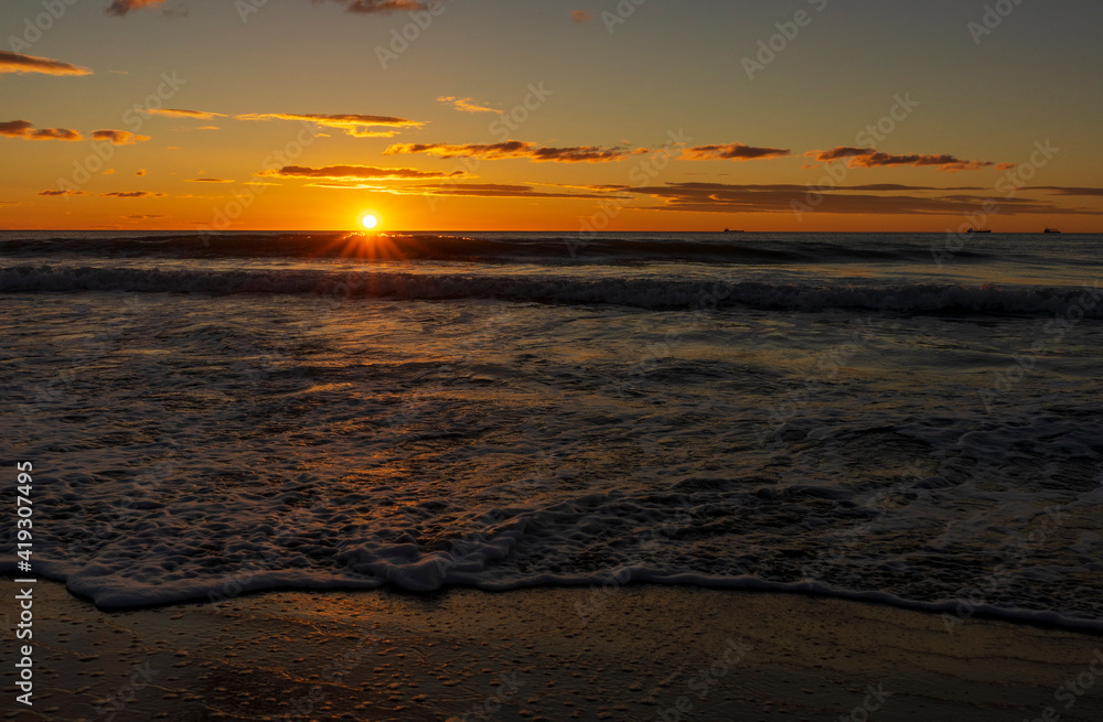 A beautiful sunrise from the shore of the beach