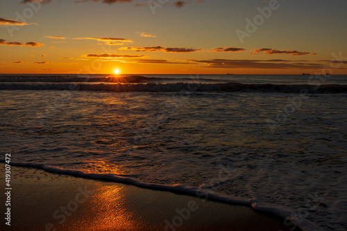 A beautiful sunrise from the shore of the beach