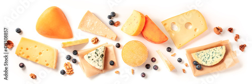 Cheese panorama, shot from above on a white background. A variety of cheeses