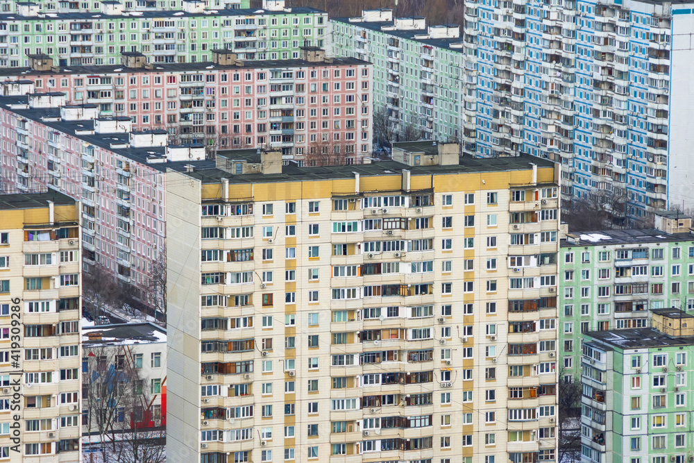 Fototapeta premium Multi-storey residential buildings made of concrete panels, sleeping areas of the metropolis.