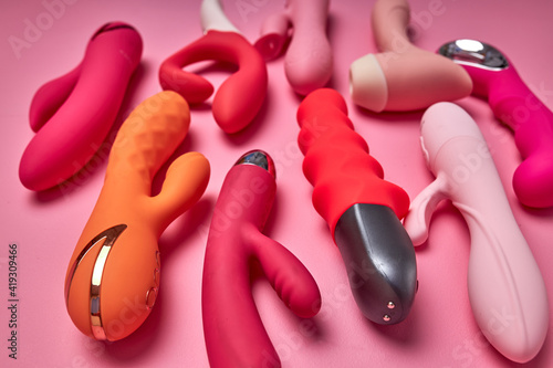 smooth and pleasant to touch sex toy isolated on pink background. Sex, orgasm and masturbation concept photo