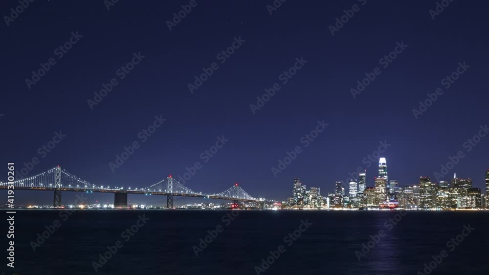 Time lapse of San Francisco city lights over bay at night Time lapse of San Francisco city lights over bay at night