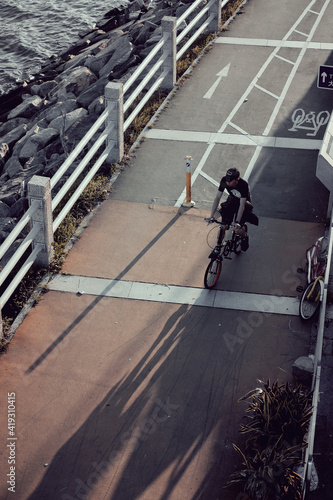 Fototapeta Naklejka Na Ścianę i Meble -  A cyclist travelling along a bike path in New Territories Hong Kong