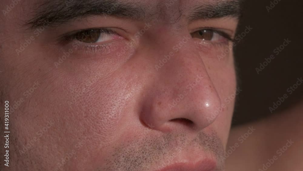Young muscular brunette man close up portrait. Slow motion Young muscular brunette man close up portrait. Slow motion