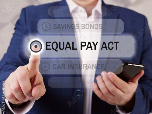 EQUAL PAY ACT inscription on the screen. Close up Bookkeeping clerk hands holding black smart phone. The Equal Pay Act is a labor law that prohibits gender-based wage discrimination in the US photo