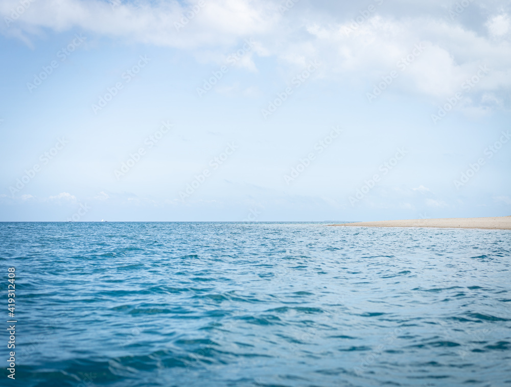 Nice far cast away tropical island on sunny day Nice far cast away tropical island on sunny day