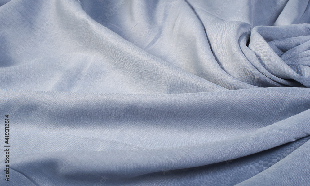Fototapeta premium Gray wavy soft fabric. Abstract background