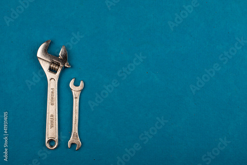 Set of tools on blue background as labour day background © StillSujith