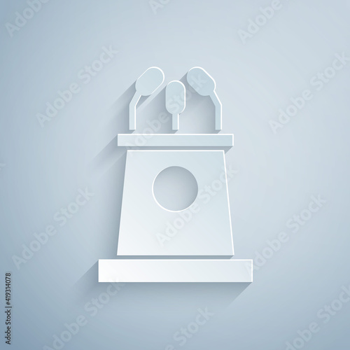Paper cut Stage stand or debate podium rostrum icon isolated on grey background. Conference speech tribune. Paper art style. Vector Illustration.