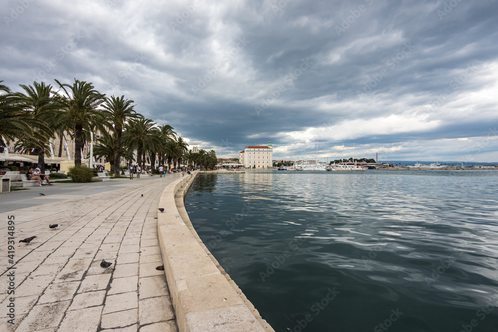 Splitska Riva Promenade with palm trees in Split, Croatia