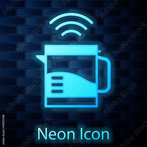 Glowing neon Smart electric kettle system icon isolated on brick wall background. Teapot icon. Internet of things concept with wireless connection. Vector.