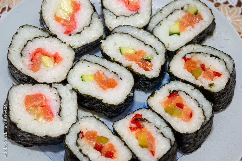 close-up - rolls with bright filling, laid out on a plate close-up - rolls with bright filling, laid out on a plate