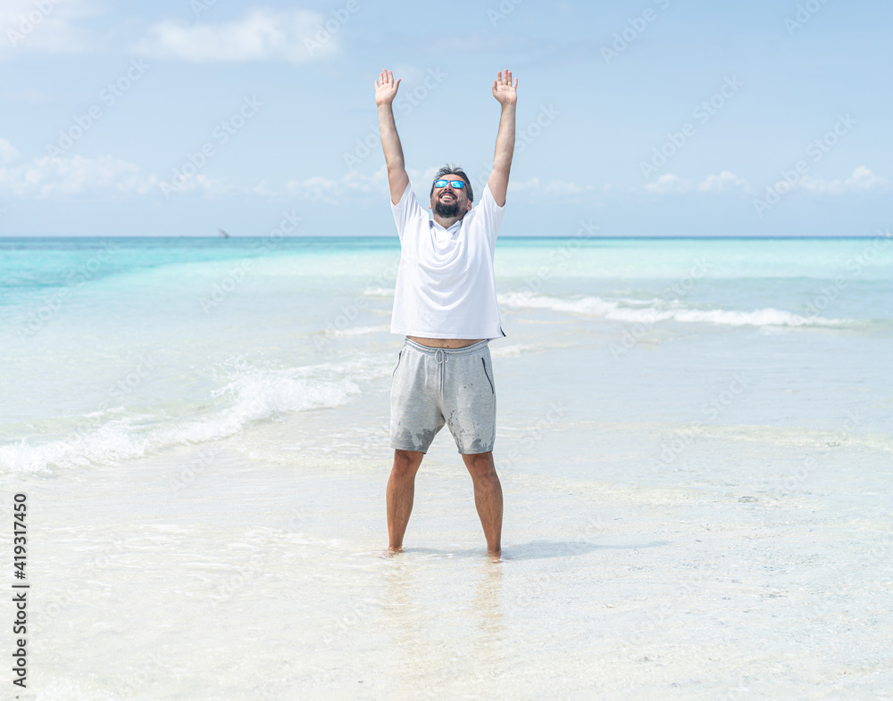 One man is enjoying beautiful tropical beach One man is enjoying beautiful tropical beach
