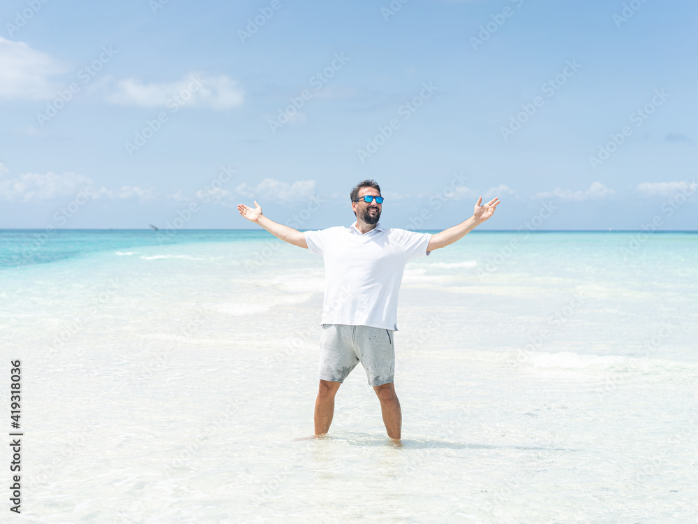 One man is enjoying beautiful tropical beach One man is enjoying beautiful tropical beach