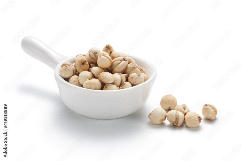 Sichuan Fritillaria cirrhosa (Chuan bei mu) in a ceramic dish. Isolated on white background. Chinese herbal medicine. Sichuan Fritillaria cirrhosa (Chuan bei mu) in a ceramic dish. Isolated on white background. Chinese herbal medicine.