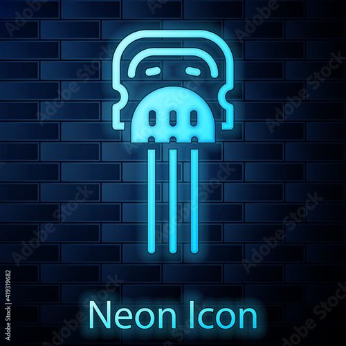 Glowing neon Flamenco woman accessories icon isolated on brick wall background. Peineta. Spanish comb. Vector. photo