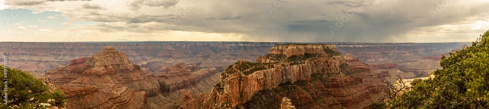 View to Grand canyon national park nature with incoming storm on horizon in Colorado, america View to Grand canyon national park nature with incoming storm on horizon in Colorado, america