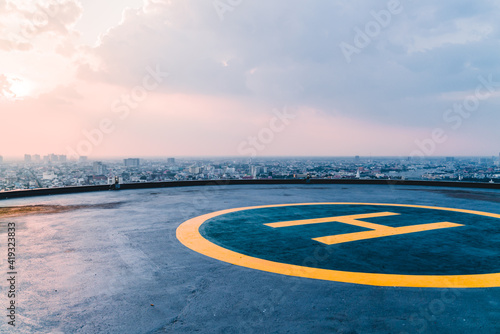 Helipad sunset Bangkok, Thailand, rooftop helicopter, top of the building, skyline, helicopter landing area in the city photo