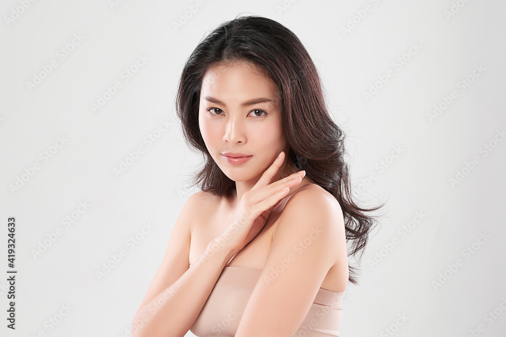 Beautiful young asian woman with clean fresh skin on white background, Face care, Facial treatment, Cosmetology, beauty and spa, Asian women portrait Beautiful young asian woman with clean fresh skin on white background, Face care, Facial treatment, Cosmetology, beauty and spa, Asian women portrait