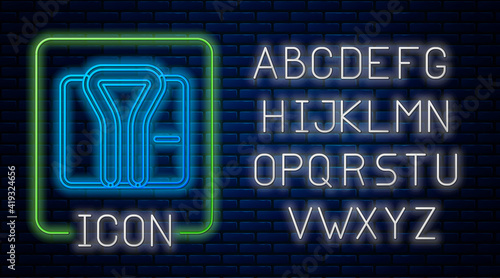 Glowing neon Bathrobe icon isolated on brick wall background. Neon light alphabet. Vector.