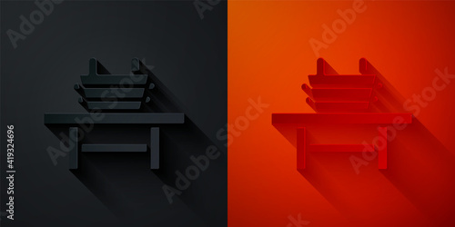 Paper cut Sauna bench with bucket icon isolated on black and red background. Paper art style. Vector.